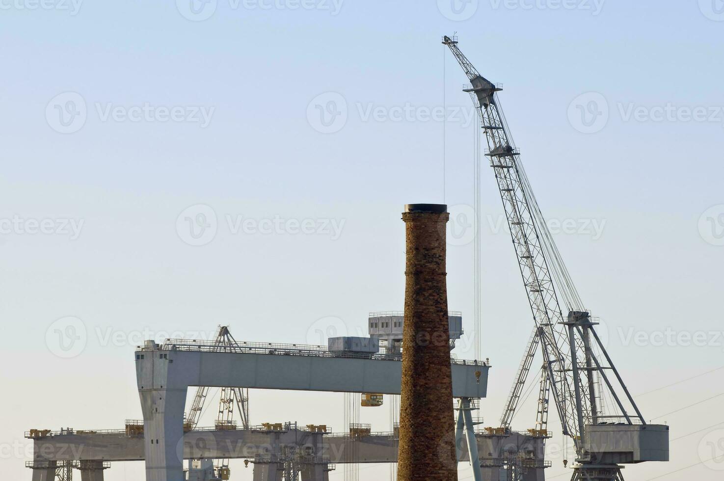 Industrial Background with Cranes and Chimneys photo