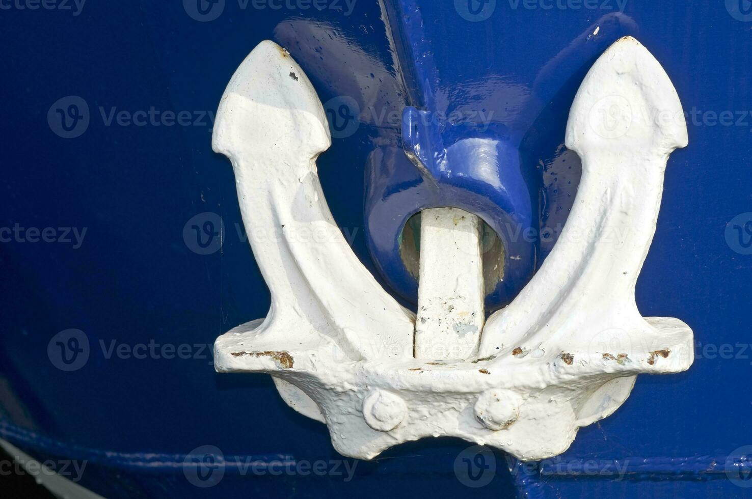 White Anchor on Blue Boat photo