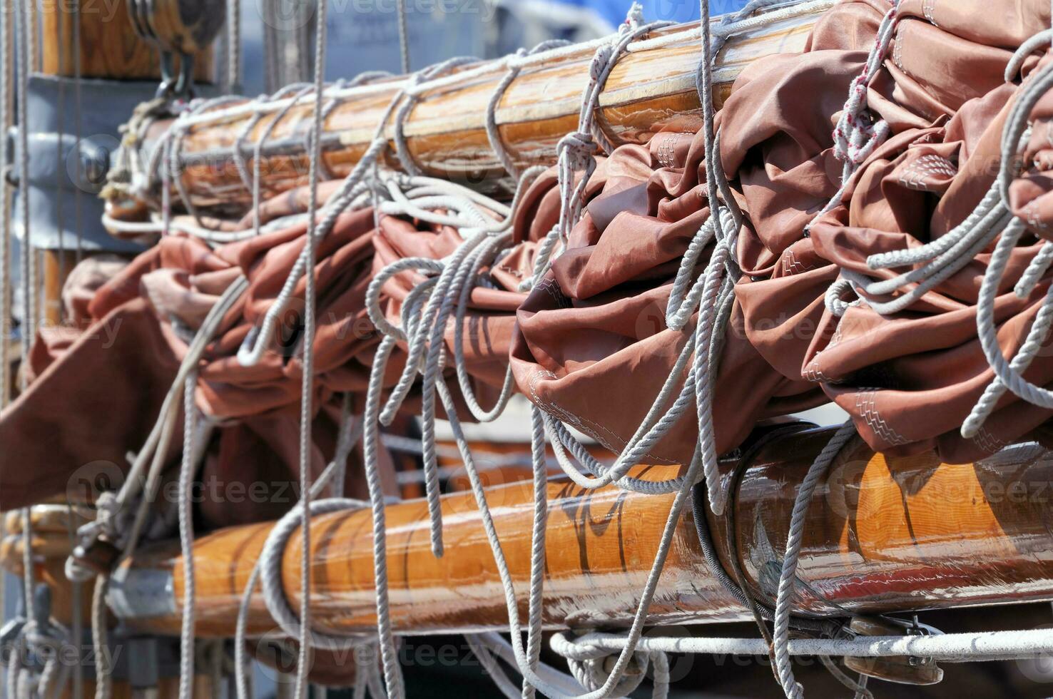 Close up of Wooden Boom with Sail on Boat photo