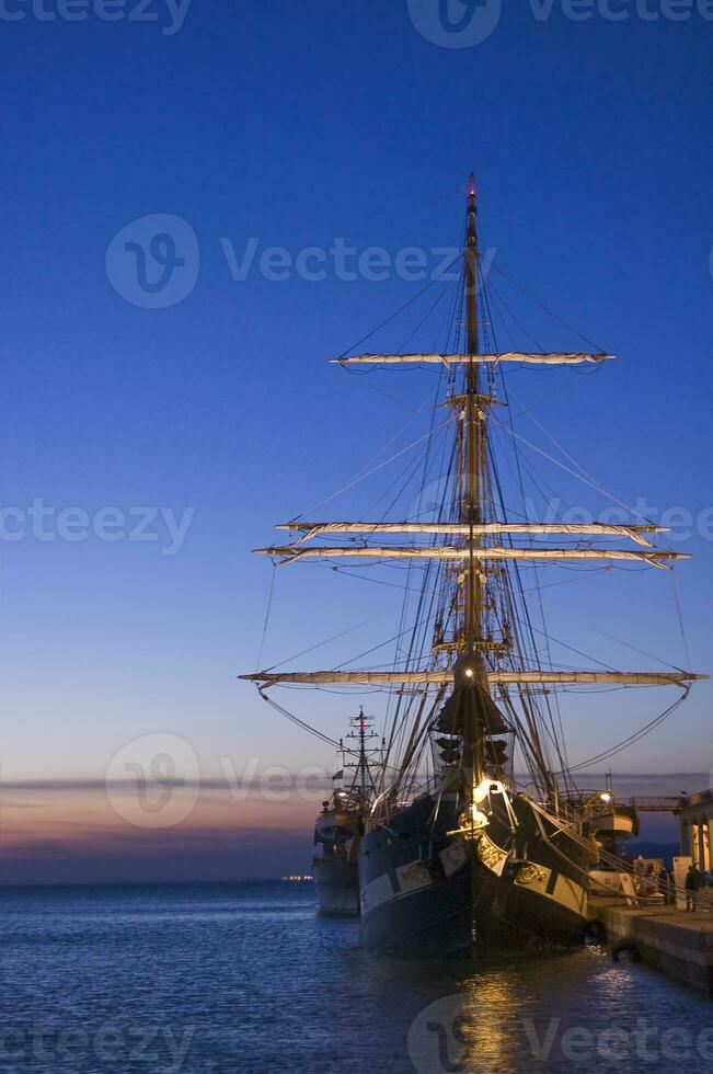 Docked Sailing Vessel at Dusk photo