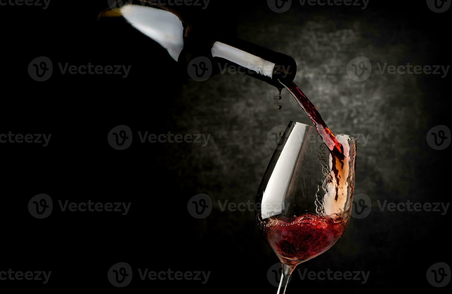 Wineglass on a black background photo