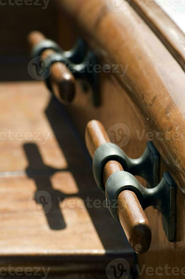 Close up of a wooden boat - Cleats photo