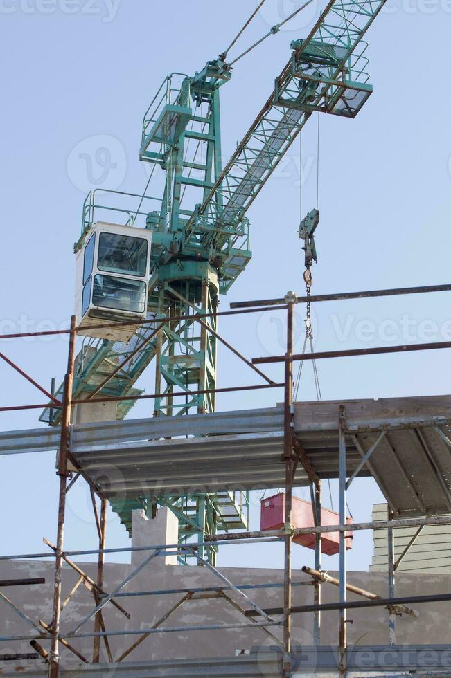 Construction Site with Crane and Scaffoldings photo