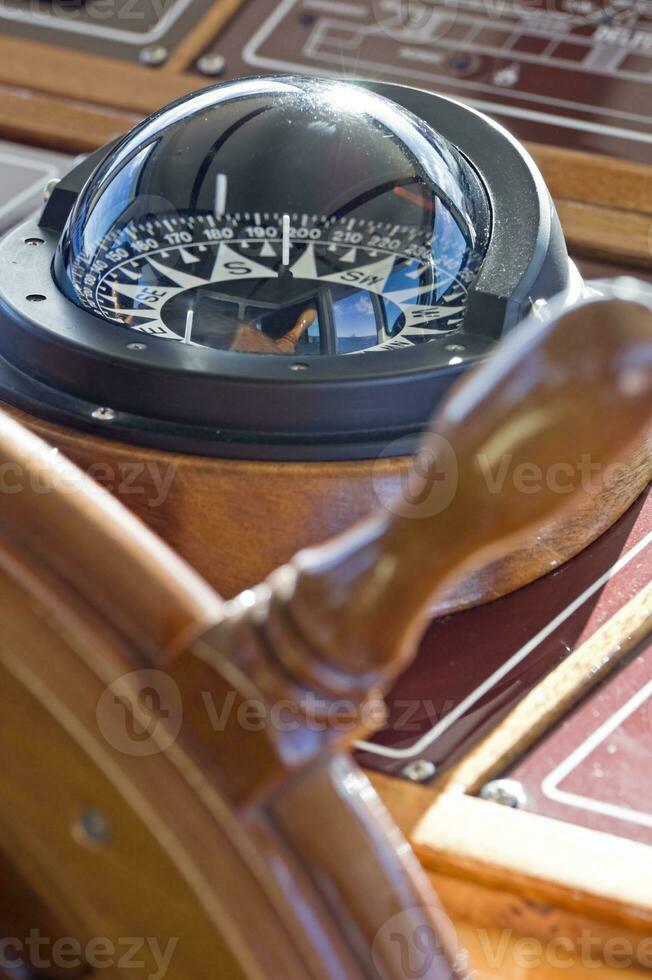 Boat Detail - Steering Wheel and Compass photo