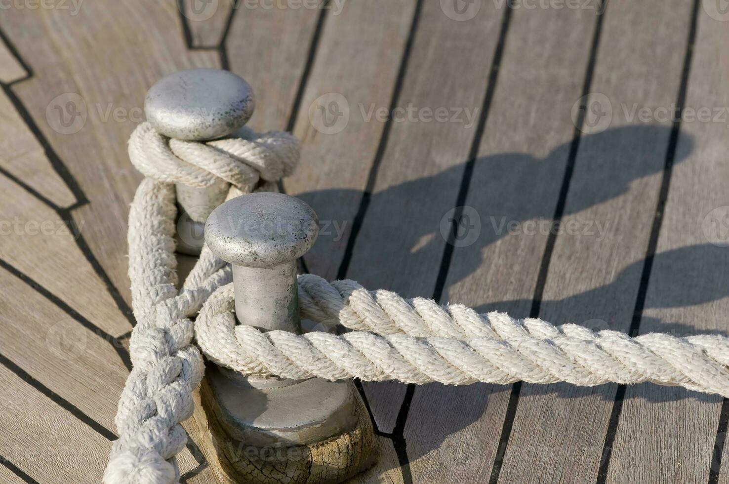 Moored boat - Ropes Fasten to Cleat photo