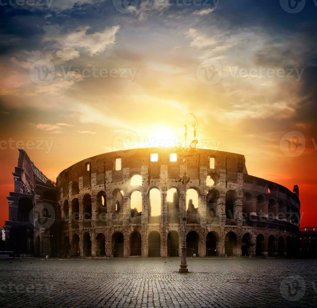 Colosseum and sunny sunrise photo