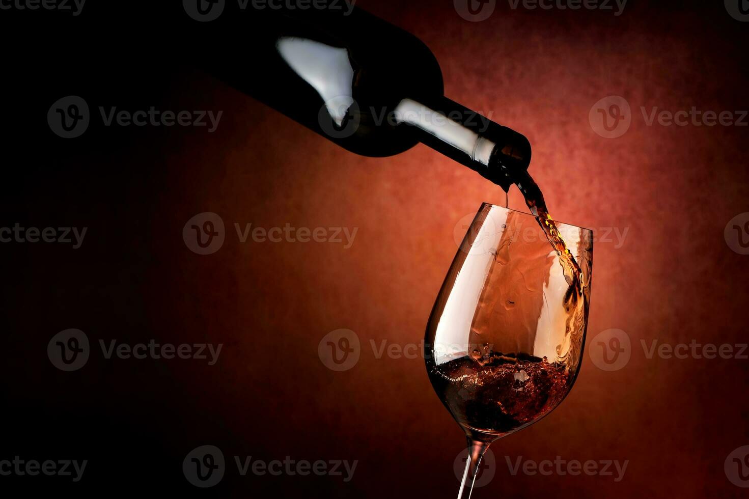 Wineglass on a brown background photo