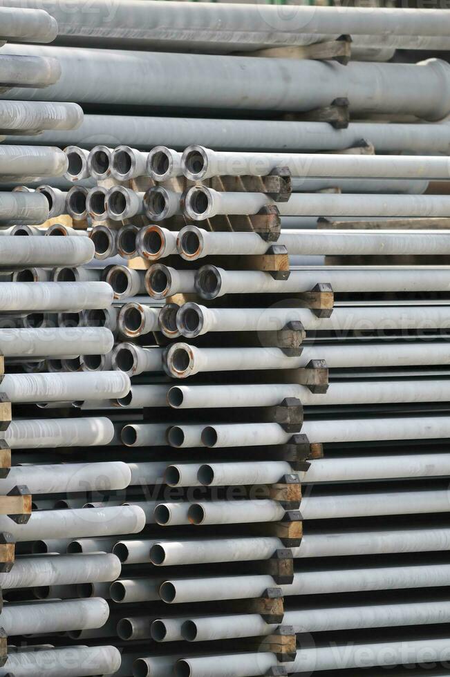 Stacks of Metallic Pipes photo