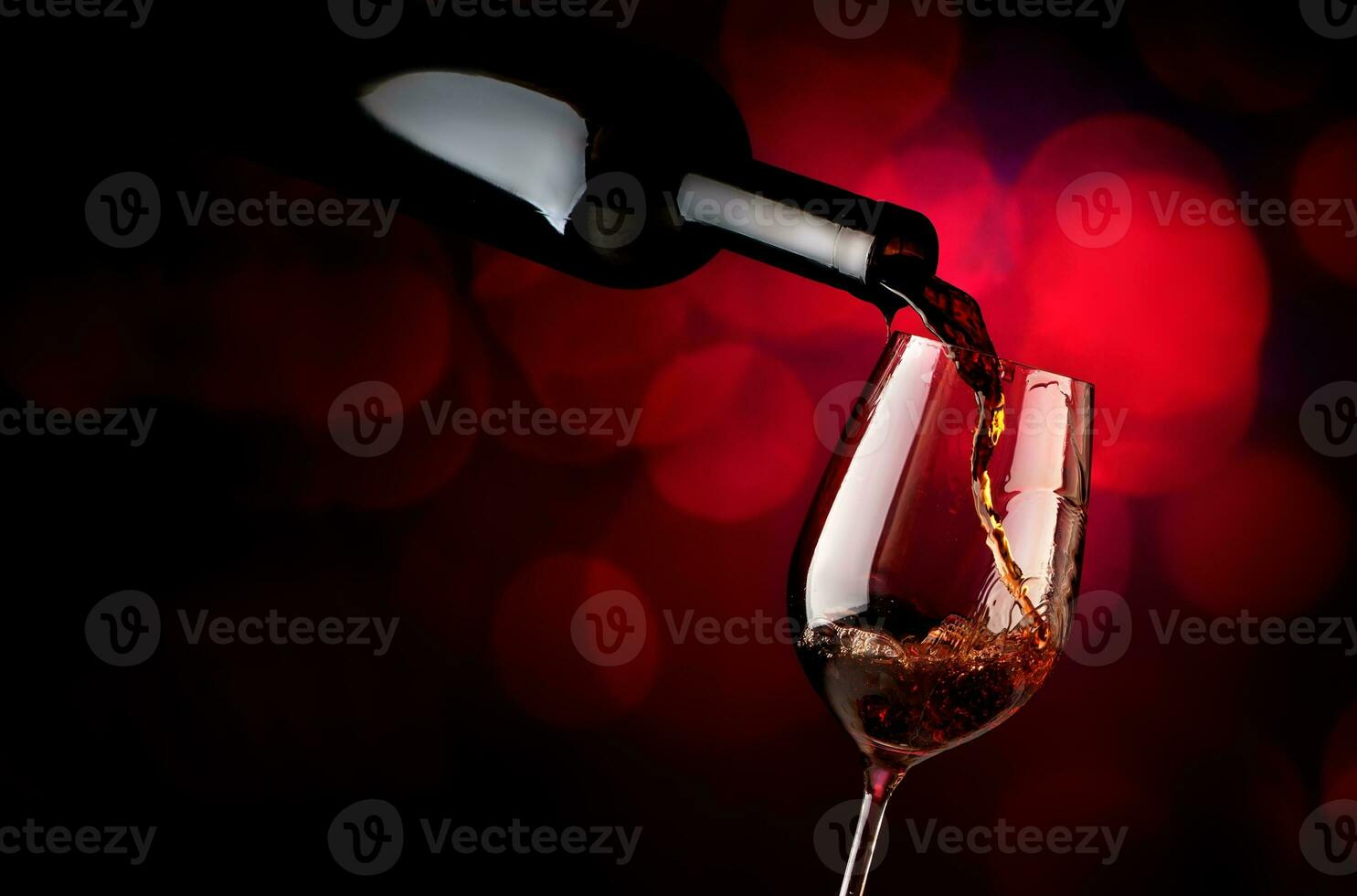 Wineglass on a vinous background photo
