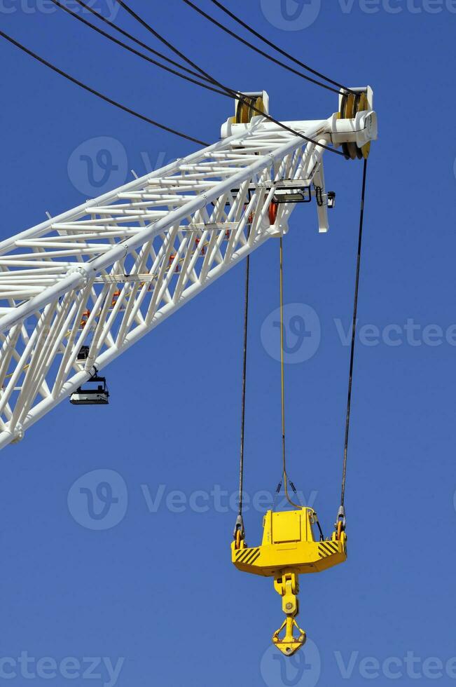 Crane with Hook agains a Blue Sky photo