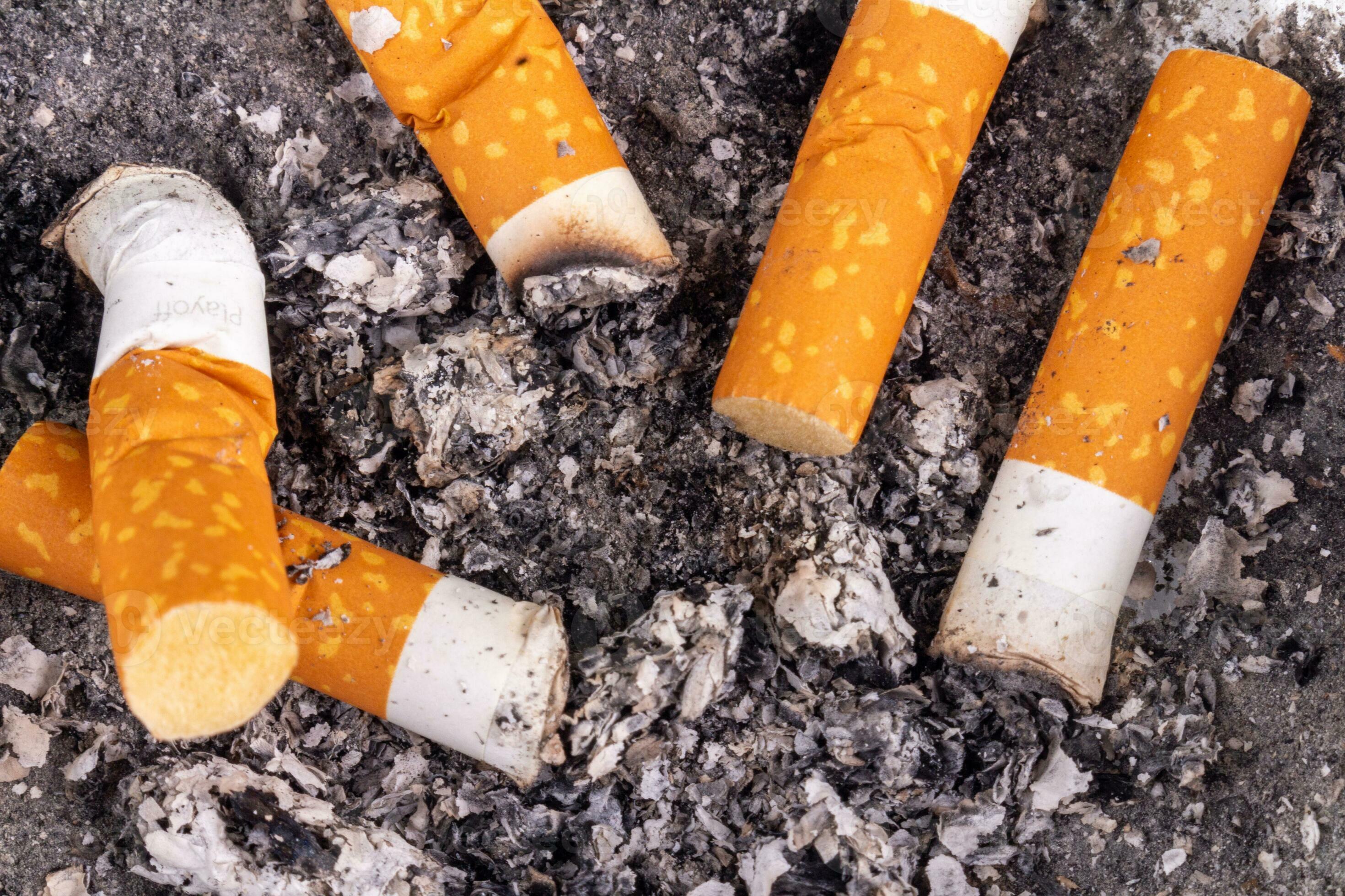 cigarette butts isolated on background 26296117 Stock Photo at Vecteezy