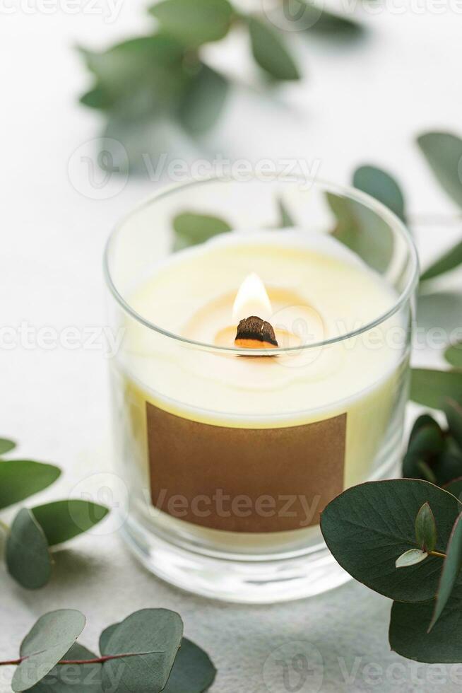 Aroma candle and eucalyptus leaves photo