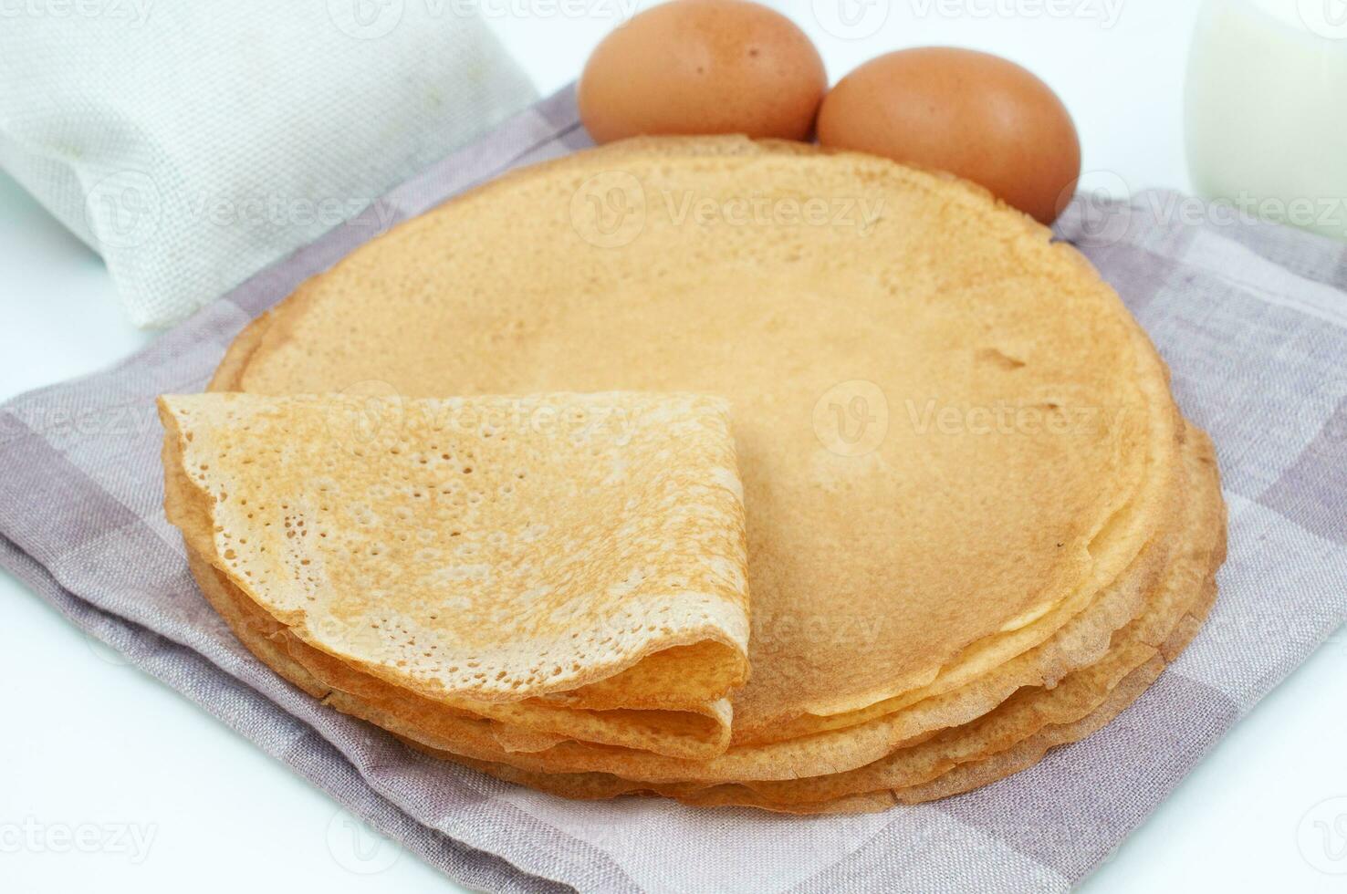 Pancakes and ingredients for cooking photo
