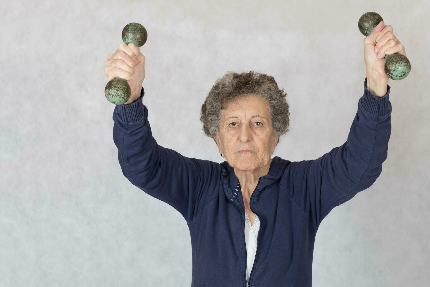 Senior woman is dressed in a sport costume photo