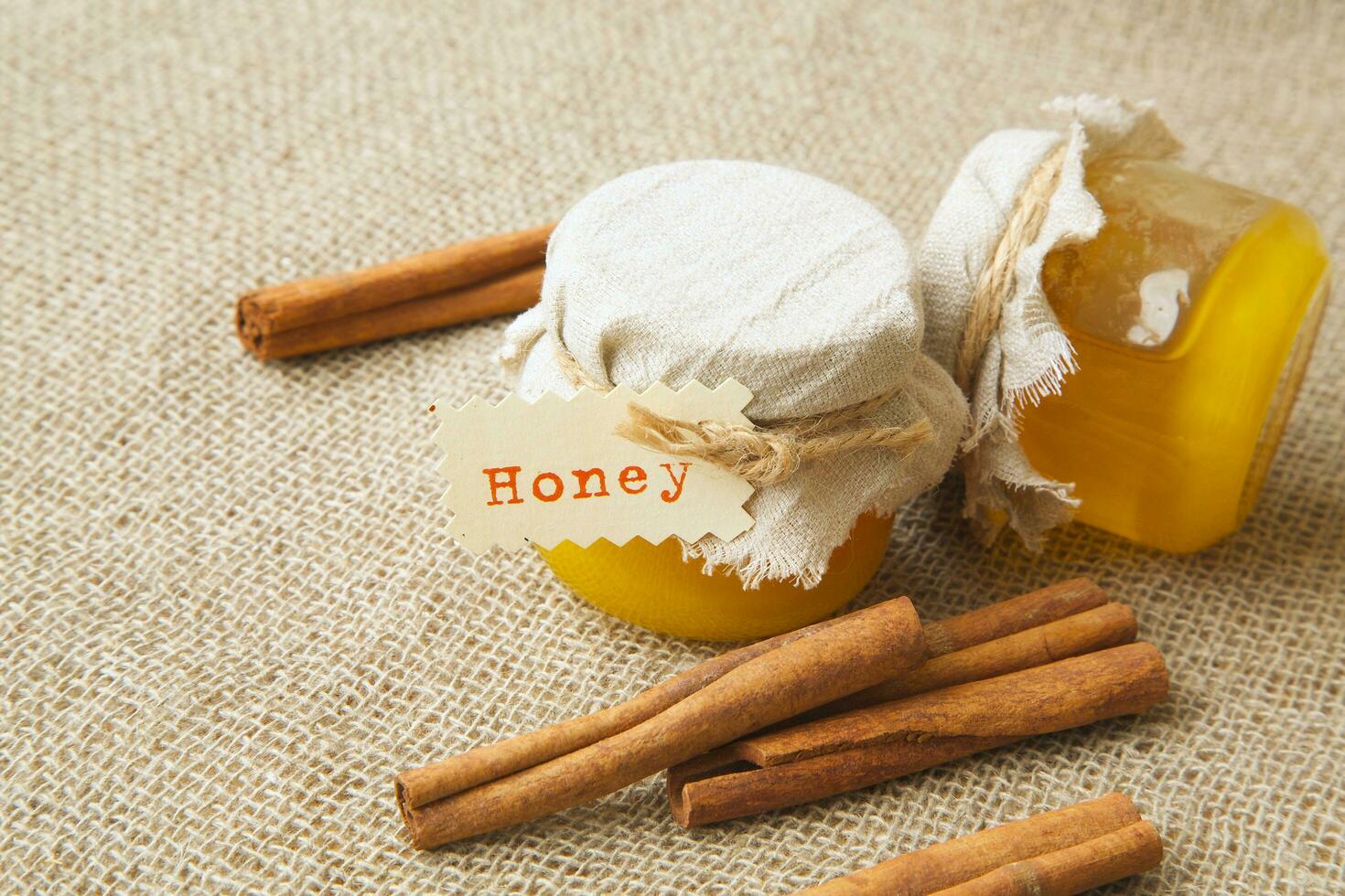 A glass of honey with cinnamon photo