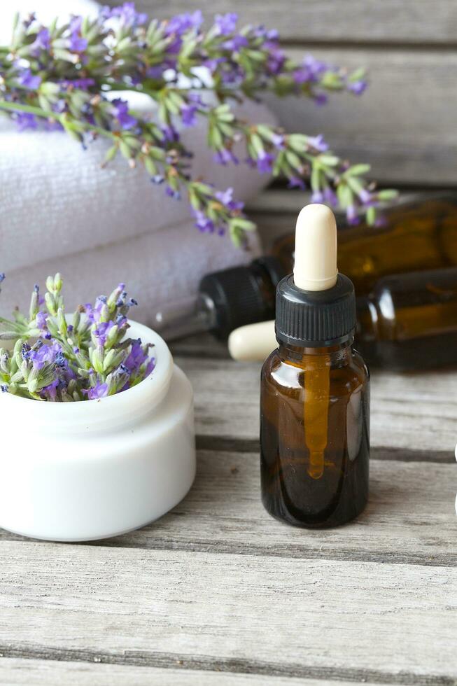 A dropper bottle of lavender essential oil. Closeup photo