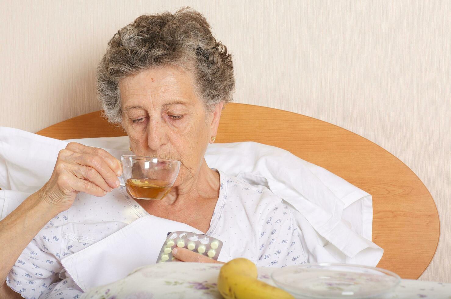 Senior woman takes some prescription photo