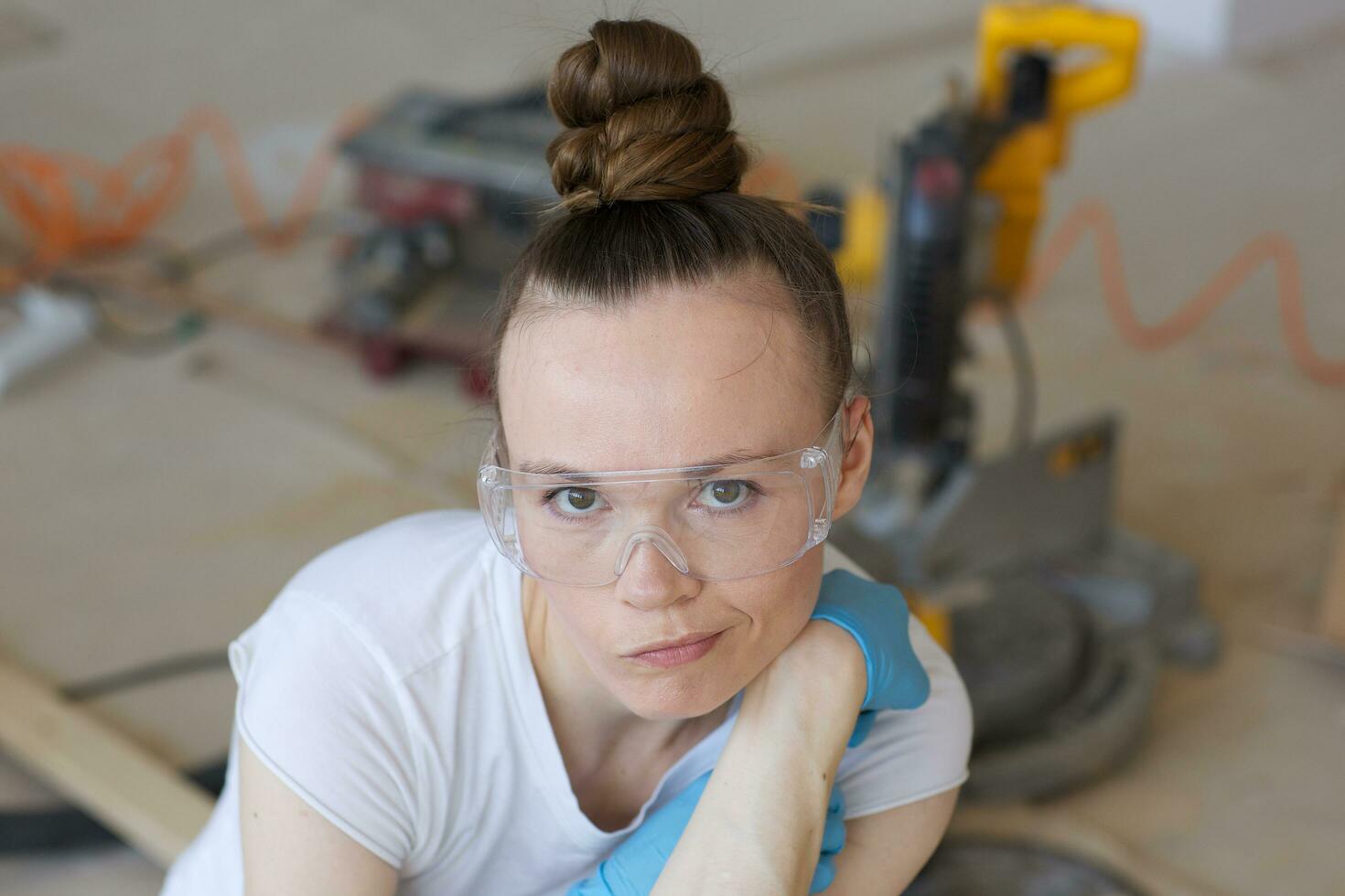 Young lady deals with wooden plinth photo