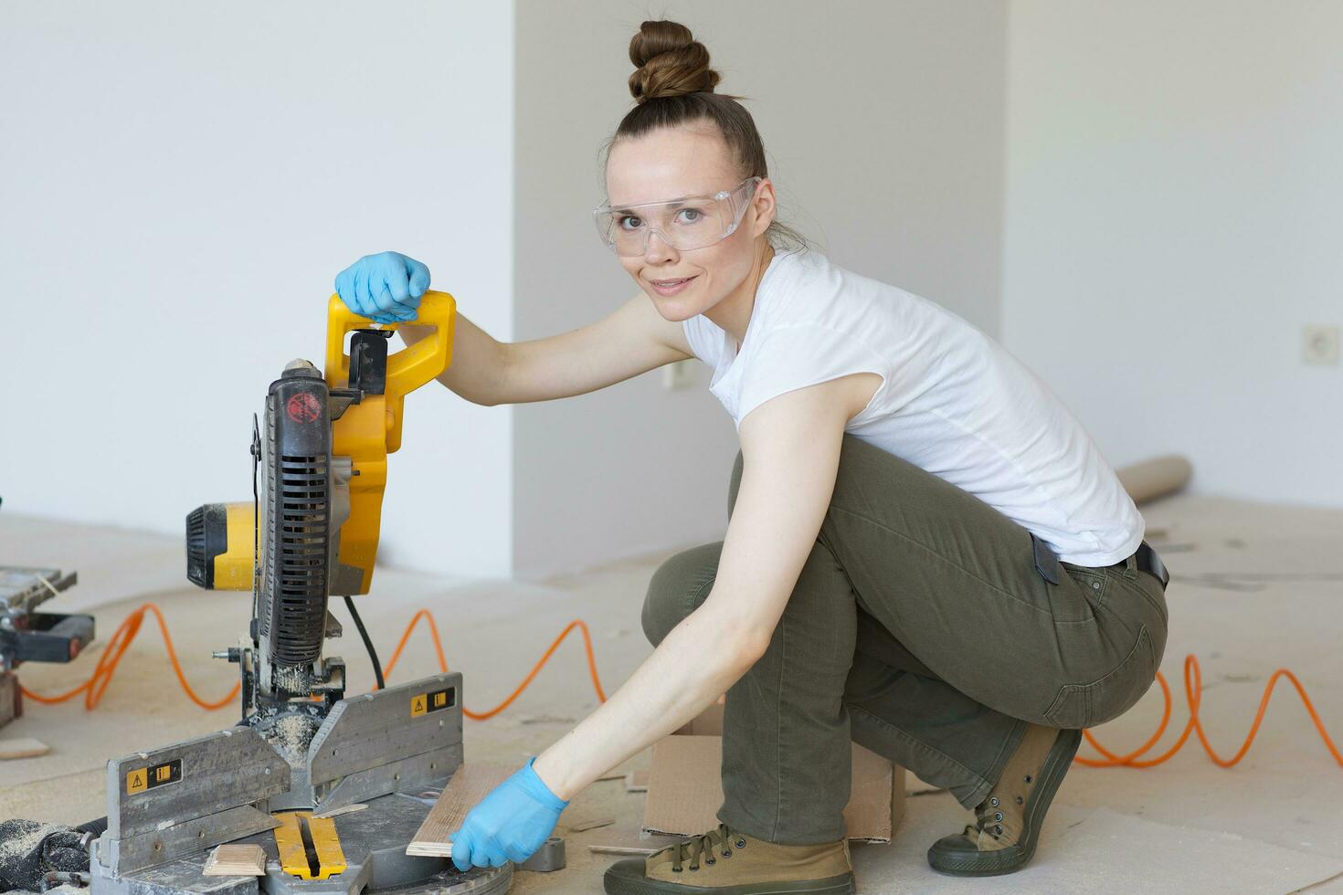 Young lady deals with wooden plinth photo