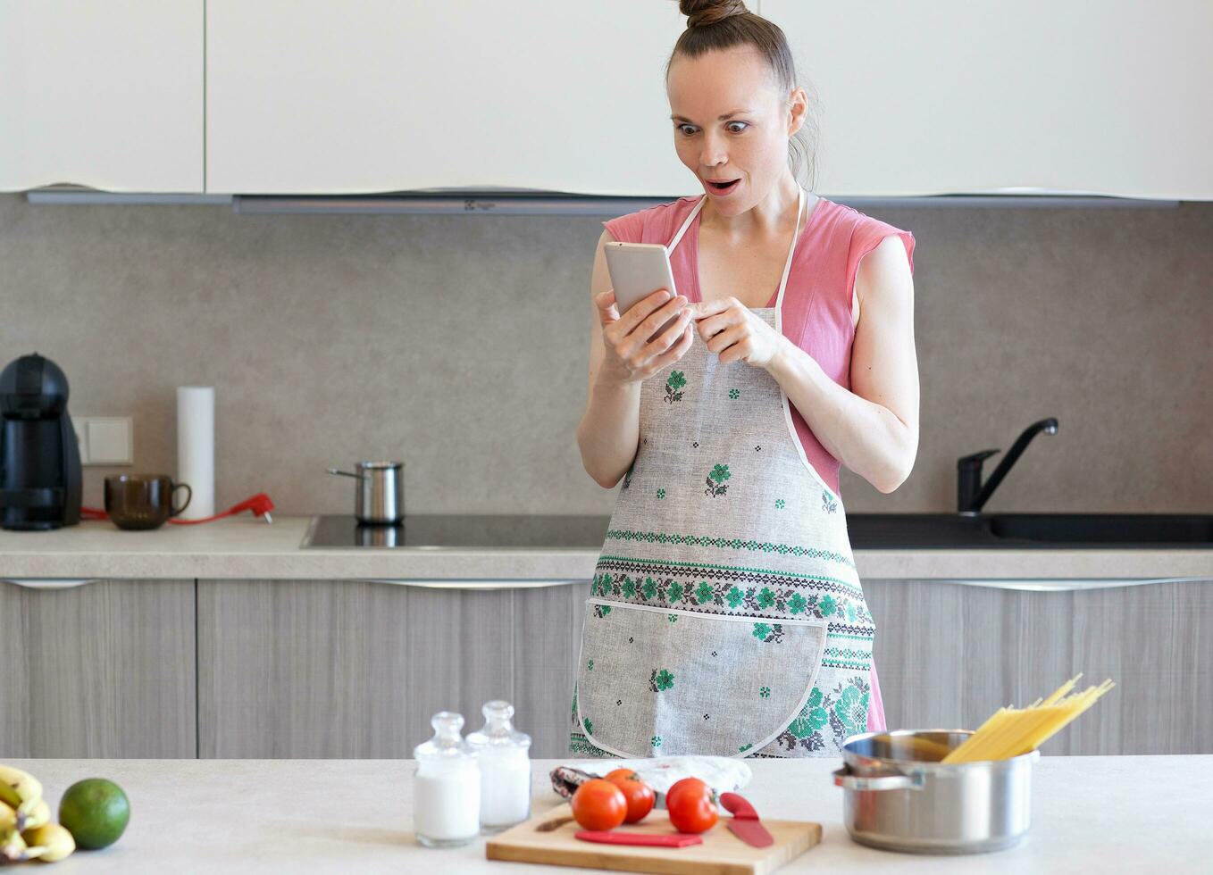 Young housewife in the kitchen photo