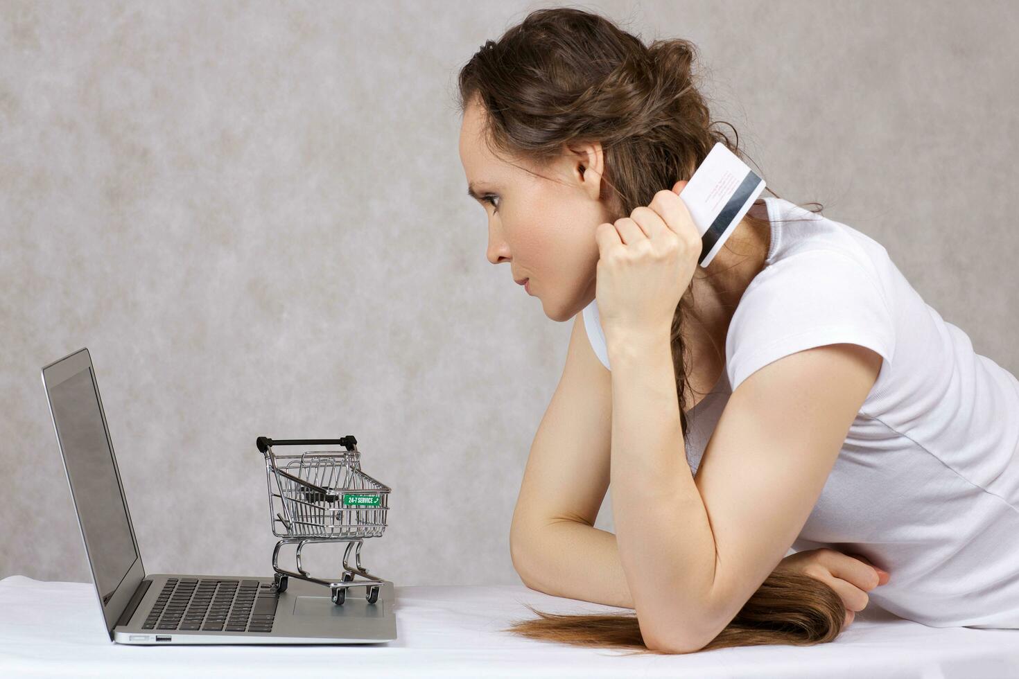 Young lady is shopping online photo