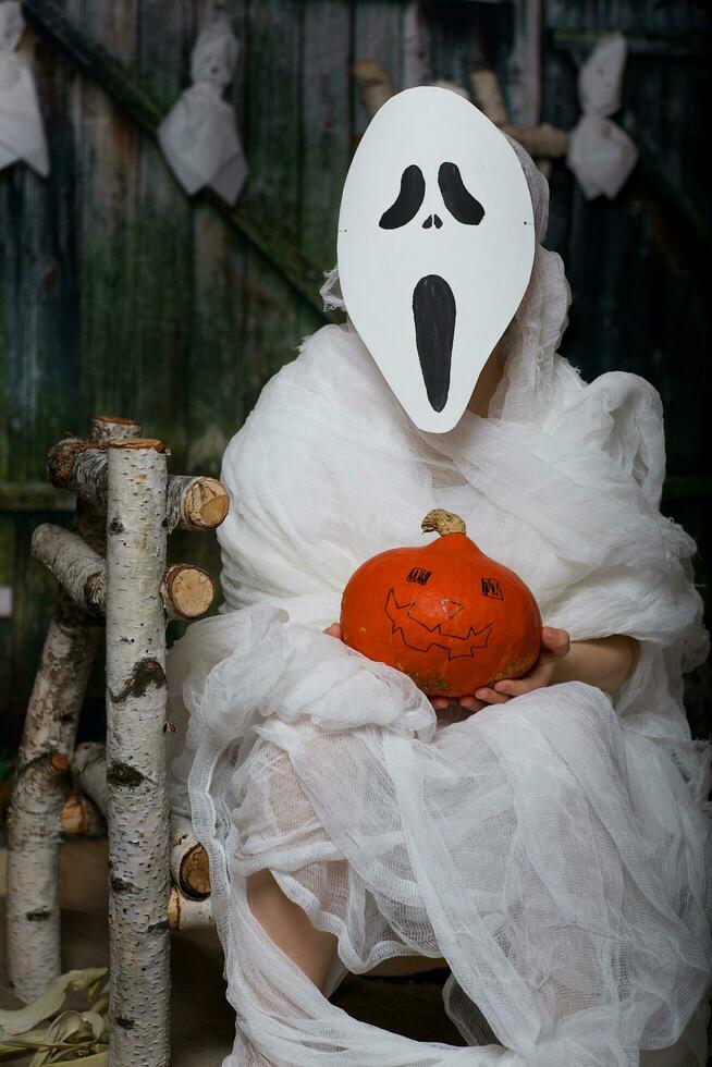 Boy of six years dressed in mummy costume. photo