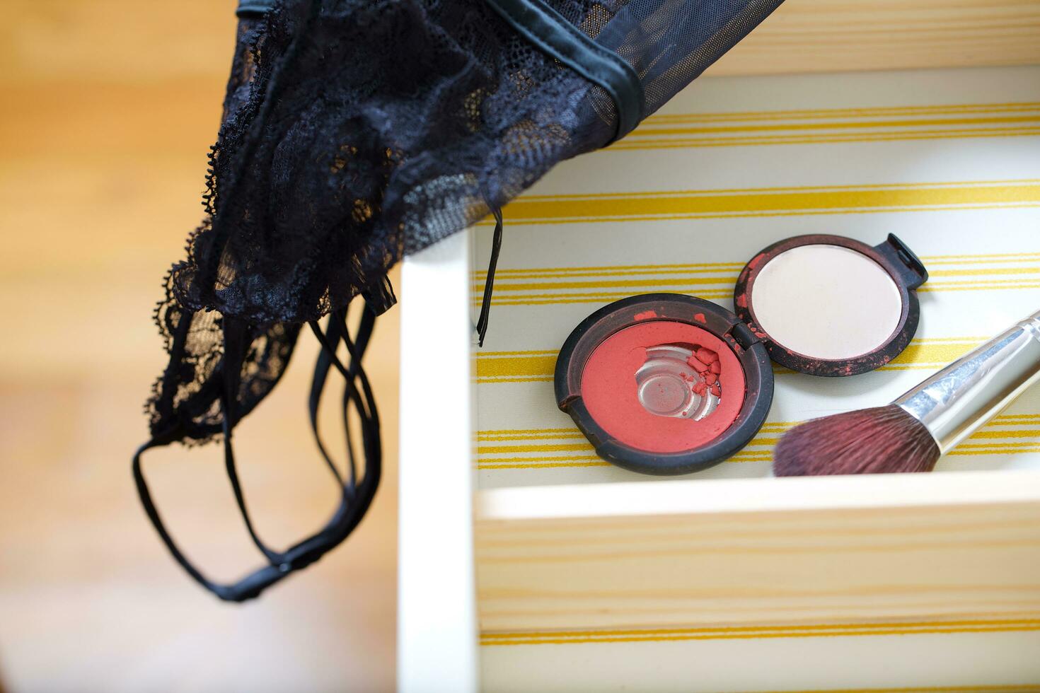 Open drawer of a woman's mirror table. photo