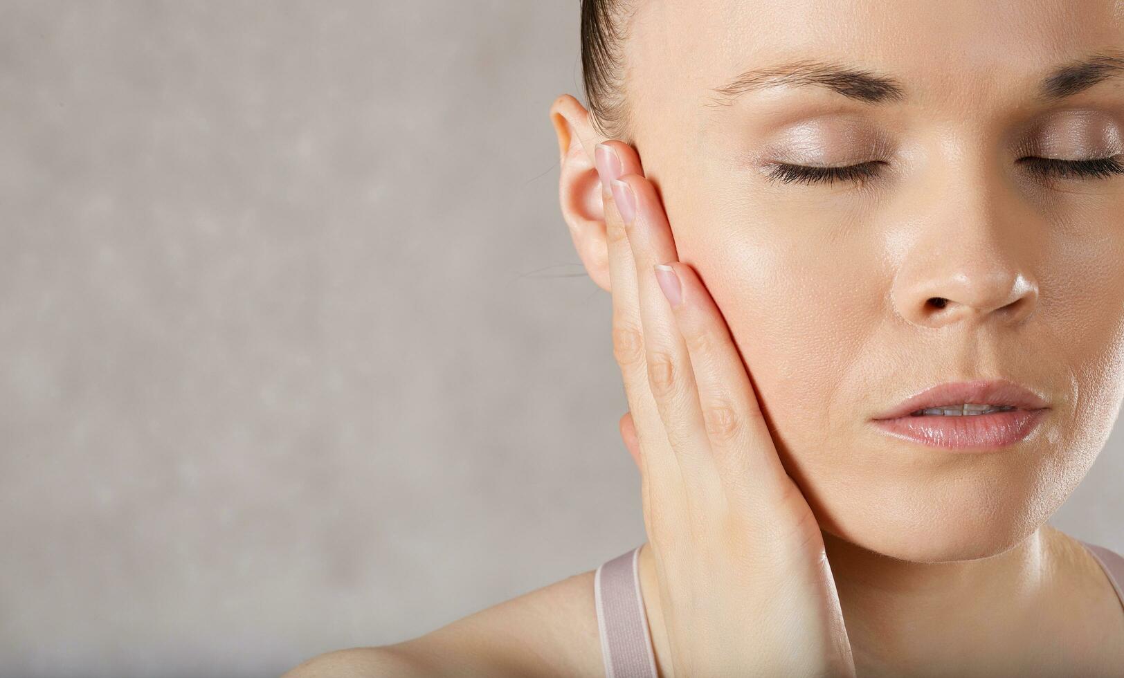 Ear of a young caucasian lady. Closeup photo