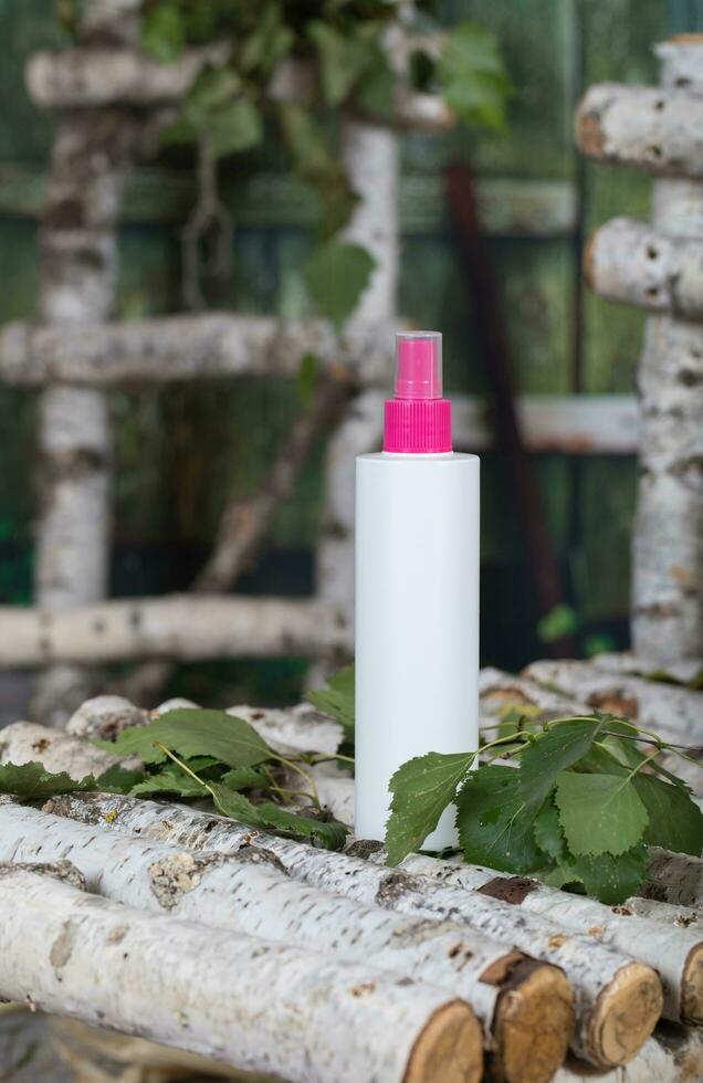 Skin and hair care birch sap water in a plastic bottle. photo