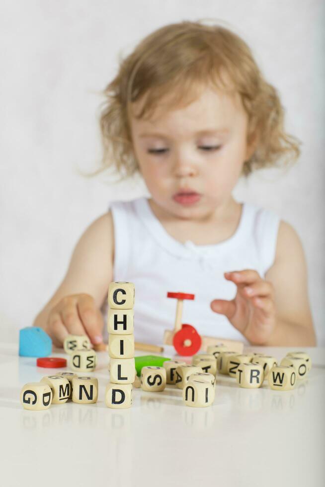 Workd CHILD is composed of wooden letters photo