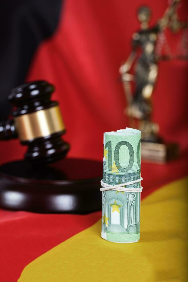 Pile of 100 euros on a German flag photo