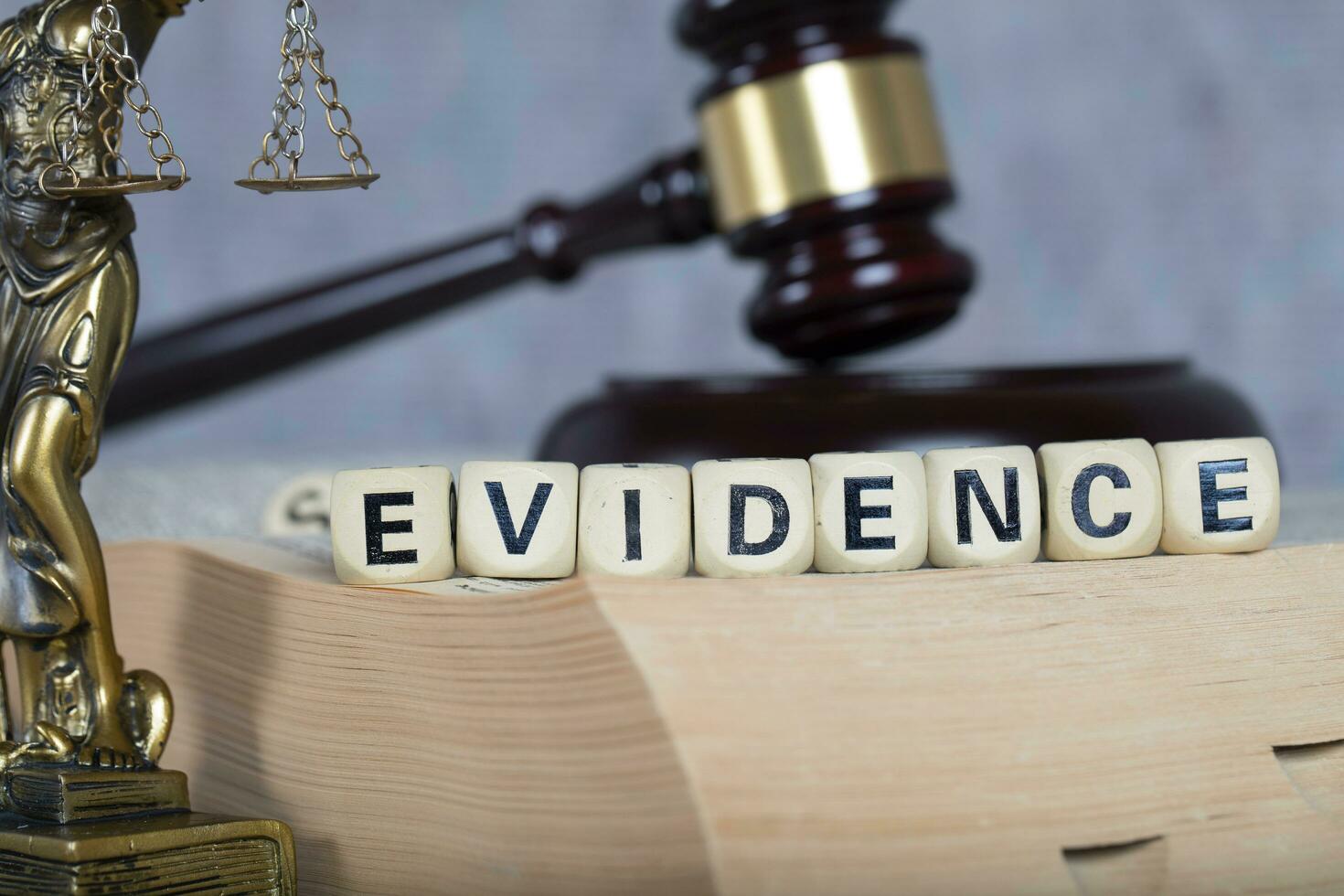 Word EVIDENCE composed of wooden letters. photo