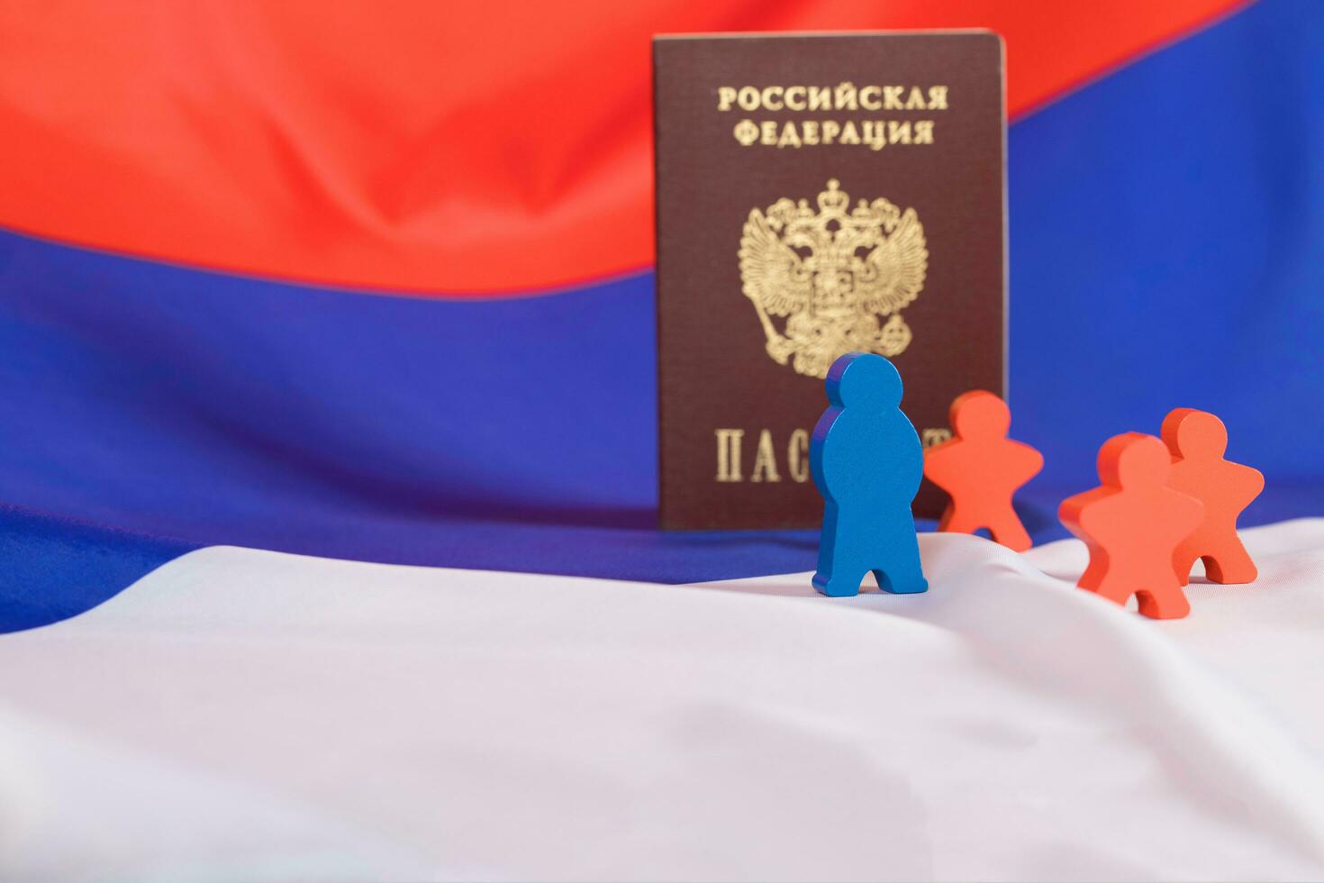 Wooden figures on Russian flag. photo