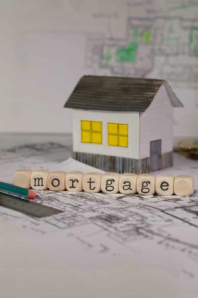 Word  MORTGAGE composed of wooden letters. Closeup photo