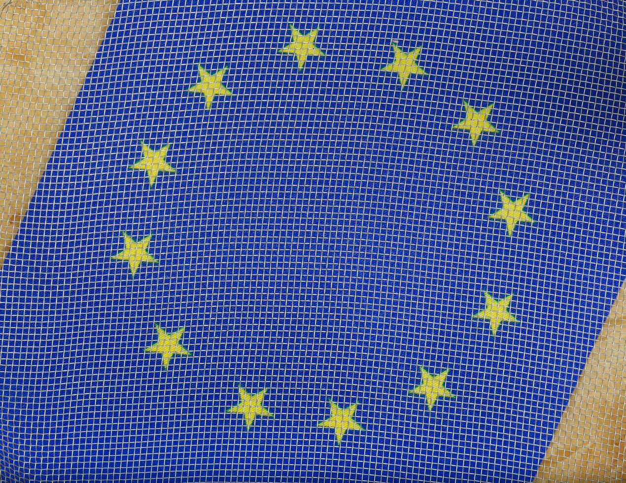 European flag under metallic net. Background photo