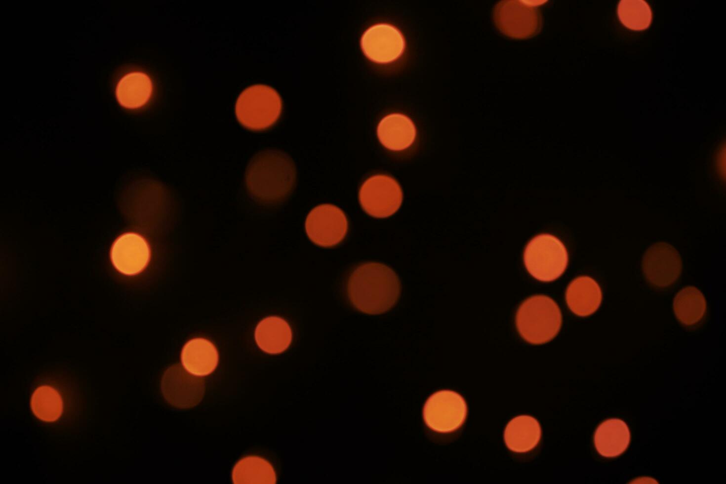 red orange bokeh black background photo