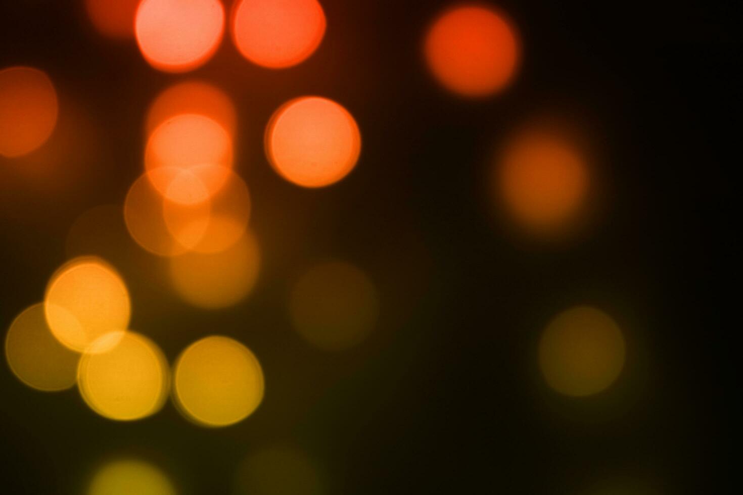 yellow orange bokeh black background photo