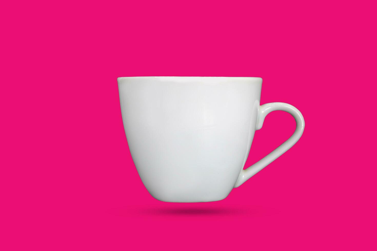 white coffee mug on a white pink background photo