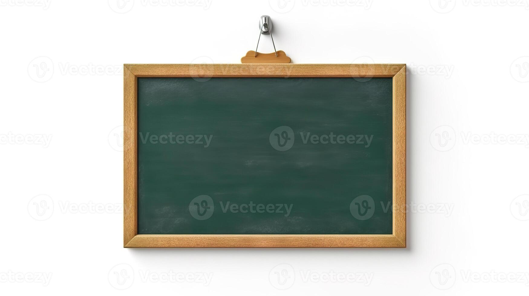 Empty green chalkboard with eraser and white chalk hang on the wall isolated. photo