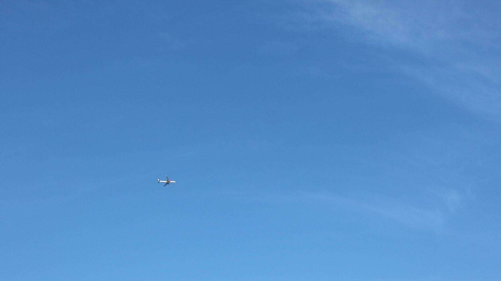 Airplane with a blue sky background photo