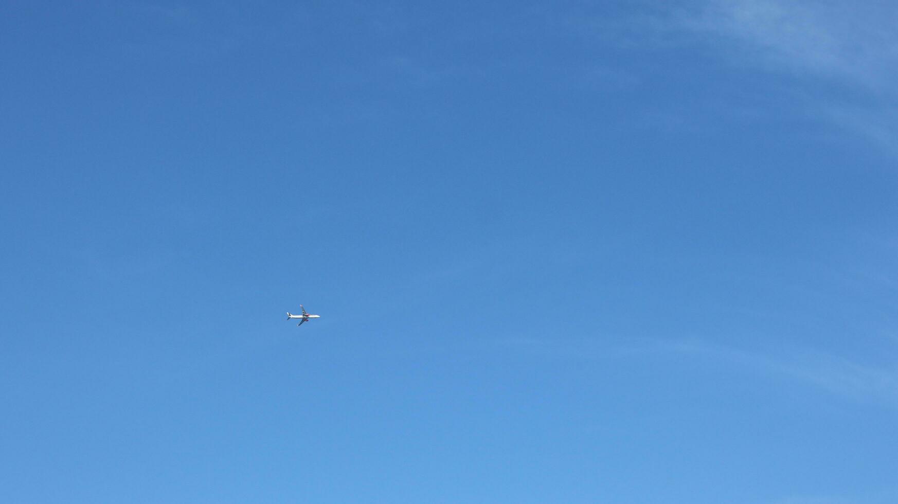 Airplane with a blue sky background photo