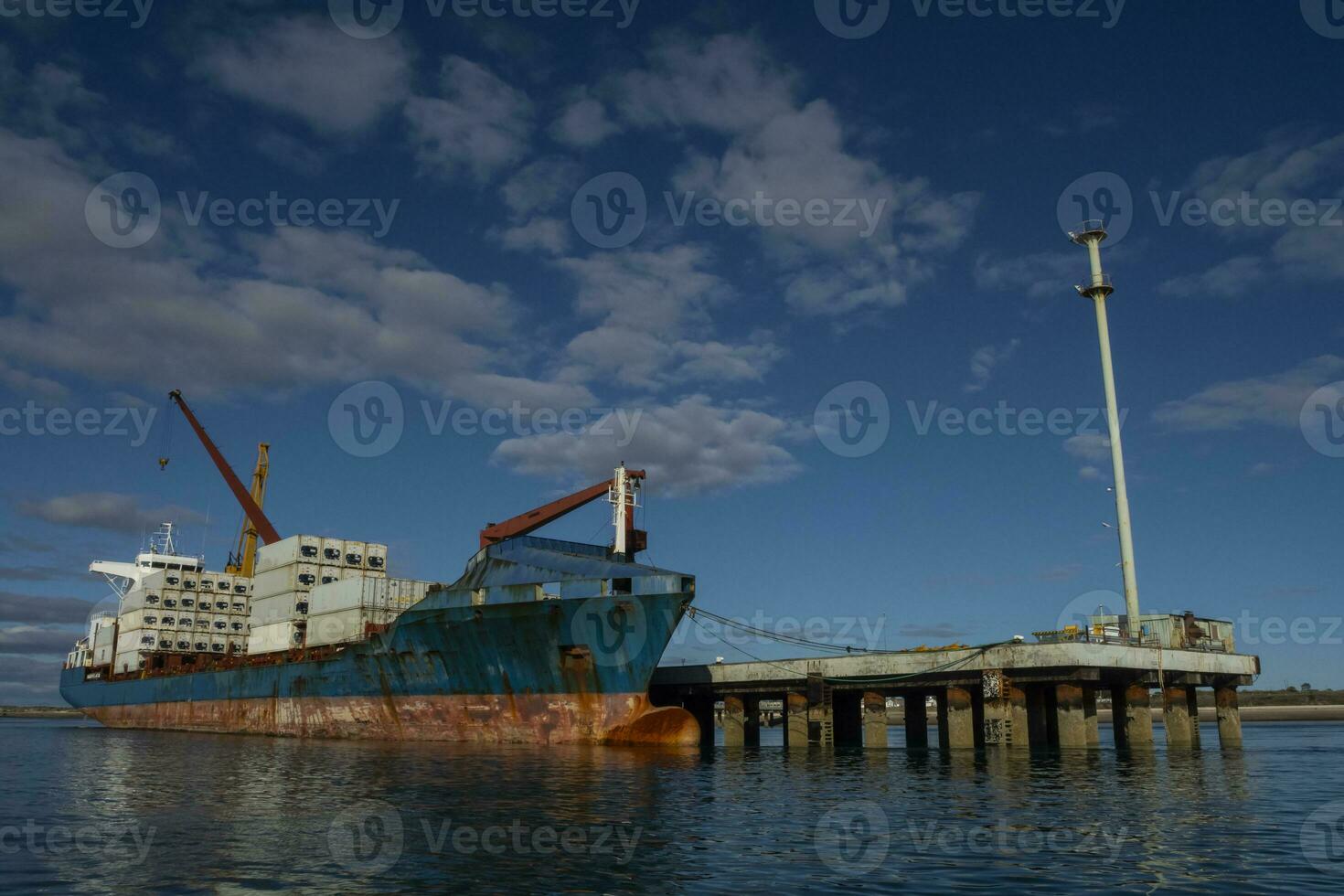 Merchant ship moored in the Port of San Antonio Este, Rio Negro Province, Patagonia, Argentina. photo