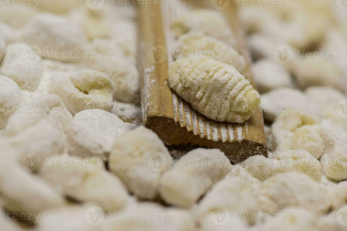 Cook homemade gnocchi on the table, Italian tradition photo