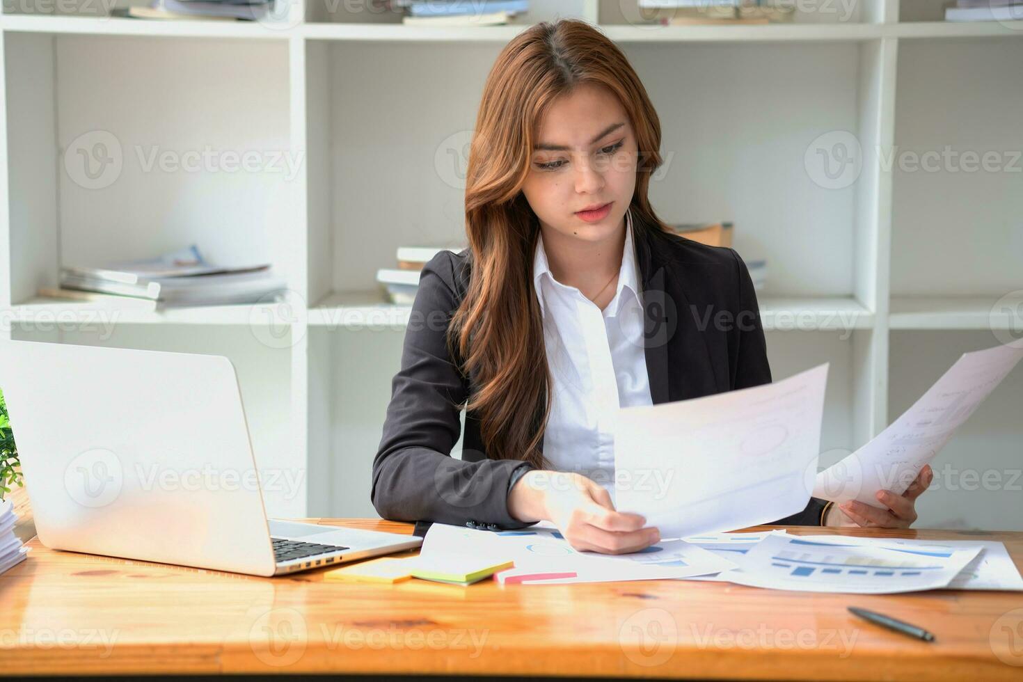 accountant, Auditor, Self-Employed, Finance and Investment, tax calculation and budget, Portrait of Asian female entrepreneur using a calculator to calculate. Company business results document. photo