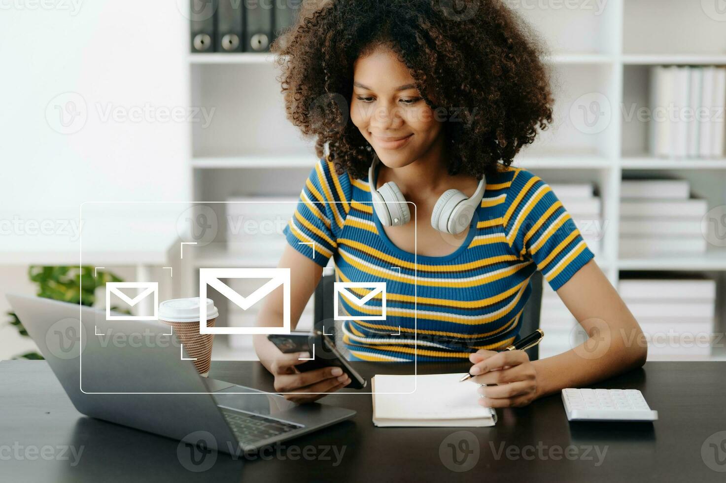 African Woman hands using Laptop, tablet typing on keyboard and surfing the internet with email icon, email marketing concept, send e-mail or newsletter, online working internet network technology. photo