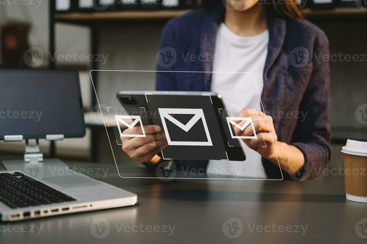 Woman hands using Laptop, tablet typing on keyboard and surfing the internet with email icon, email marketing concept, send e-mail or newsletter, online working internet network technology. photo