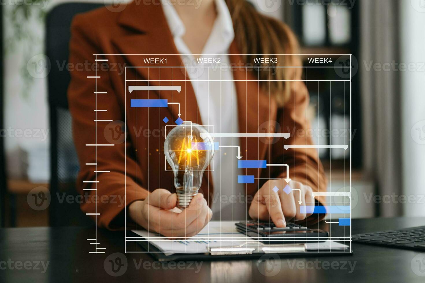 Businesswoman holding and putting lightbulb on coins stack on table for saving energy and money conceptIdea saving energy and accounting finance photo