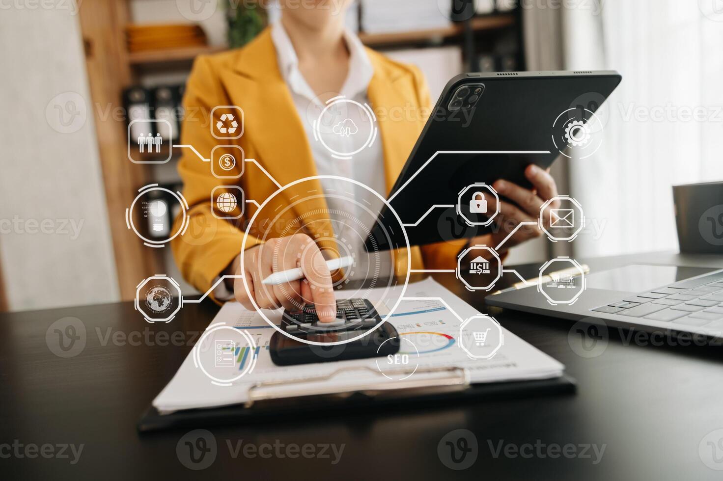 Digital marketing media in virtual screen.businesswoman hand working with mobile phone and modern compute with VR icon diagram at office in morning light photo