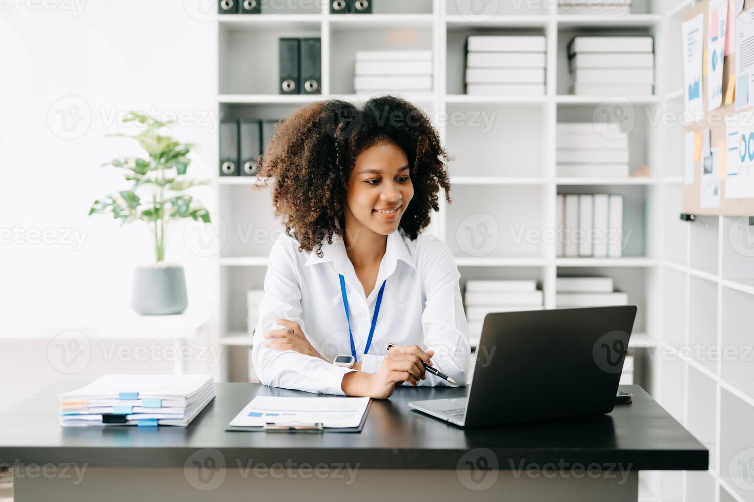 Business woman using tablet and laptop for doing math finance on an office desk, tax, report, accounting, statistics, and analytical research concept in office photo