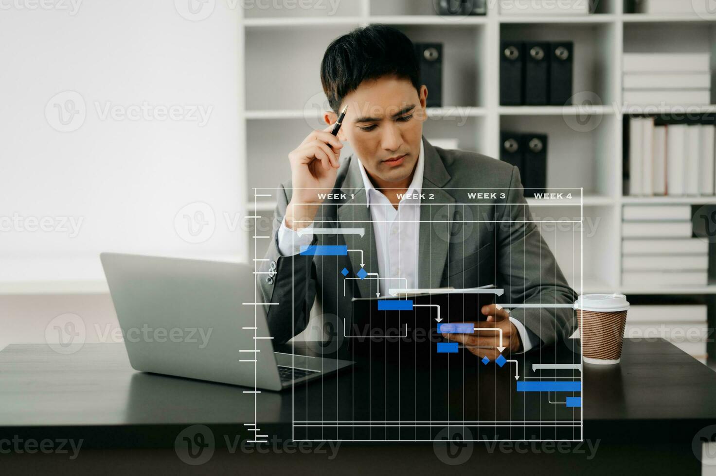 Project manager working and update tasks with milestones progress planning and Gantt chart scheduling diagram. business working with smart phone, tablet and laptop in office. photo